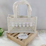A rustic yet elegant jute bag featuring beautiful lace, suitable for wedding favor gifts, nikah ceremonies, and bridal showers. Ideal for bridesmaid gifts and wedding accessories.