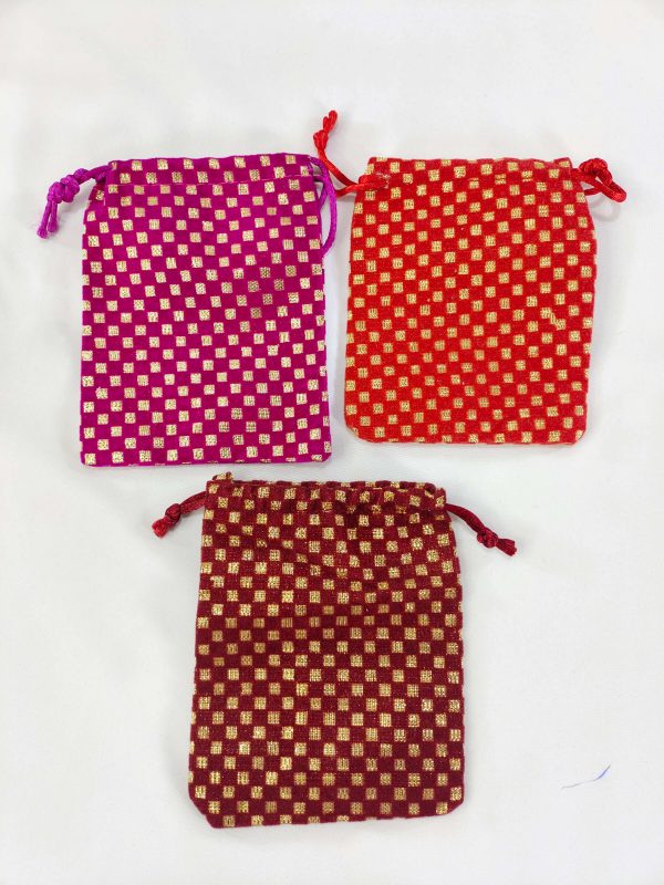 Beautifully crafted maroon, red, and magenta Ginni pouch wedding potlis with golden embroidery, for bridal accessories