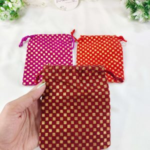 Set of three Handmade Gift Potli gota-designed Ginni pouch wedding potlis, ideal for bridesmaid gifts and wedding favors. Features a rich golden checkered pattern
