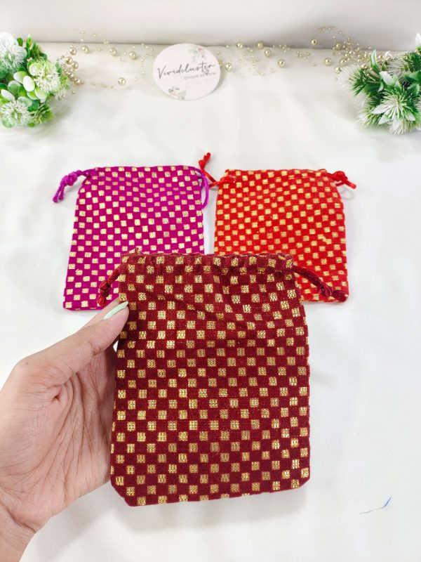 Set of three Handmade Gift Potli gota-designed Ginni pouch wedding potlis, ideal for bridesmaid gifts and wedding favors. Features a rich golden checkered pattern