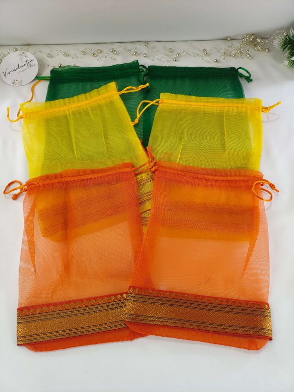 A colorful collection of tissue potli bags, perfect for wedding favors, nikah ceremonies, and special occasions. These bags are ideal for gift hampers