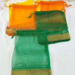 A set of vibrant tissue potli bags, perfect for wedding gifts, nikah ceremonies, and birthday celebrations. These bags are also ideal for anniversary gifts