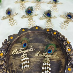 feather design ladkewale brooch with pearls, this exquisite brooch is perfect for the groom's side. Use it as a Bharati brooch or wedding favor